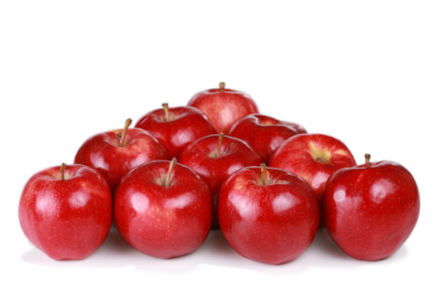 Ten apples stacked in a pyramid