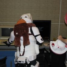 An Imperial stormtrooper experimentally taps at the Apple. This is the Apple you're looking for
